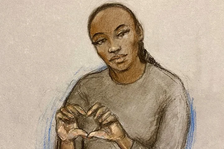 X Factor finalist facing attempted murder charge makes heart sign from dock