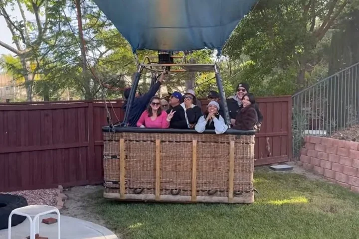 Man sees the funny side after hot air balloon carrying 13 people lands in his garden