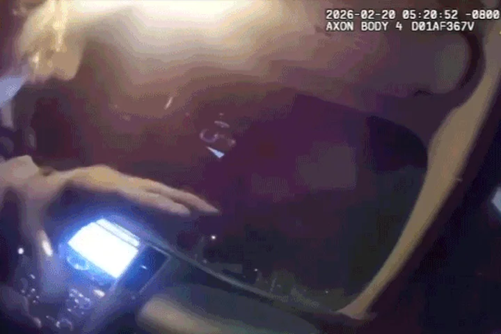 Body camera video shows police officer allegedly kidnapped by armed robbery suspect in roadside showdown