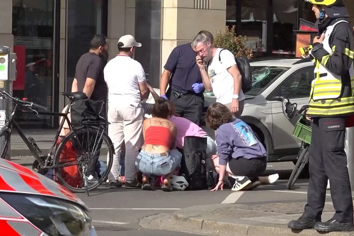 Car plows into pedestrian zone killing 2 as police detain driver and investigate motive
