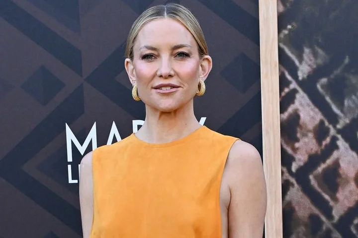 Kate Hudson turns heads in bold yellow dress with revealing cutouts while on the red carpet