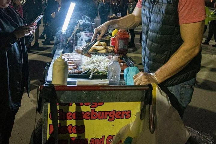A heated hot dog vendor turf war leads to a sidewalk brawl between two female wiener slingers