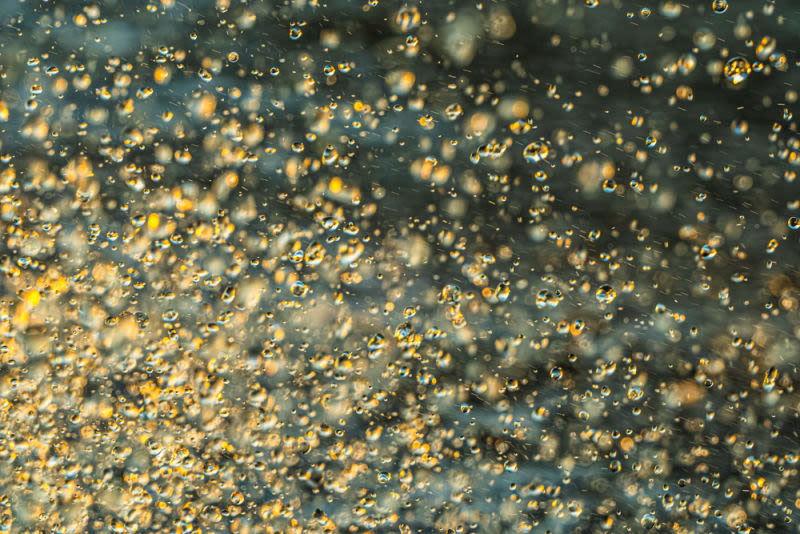It captures the exact moment of the collision between water and sunlight. With a vibrant rhythm and a palette of earthy and metallic colors, this image brings energy and modernity to any printed object.
