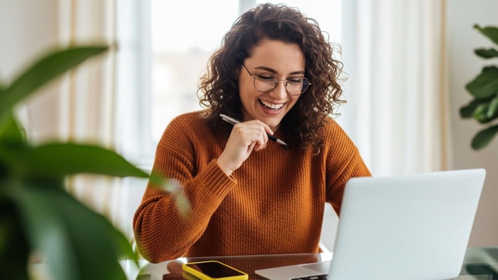 Joyful Professional Working Remotely at Modern Corporate Setup