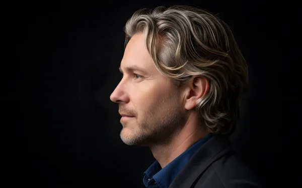 A profile view captures the distinguished man, highlighting his features and creating a sense of depth and character.