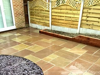 A cleanly laid paved patio area with curved edge