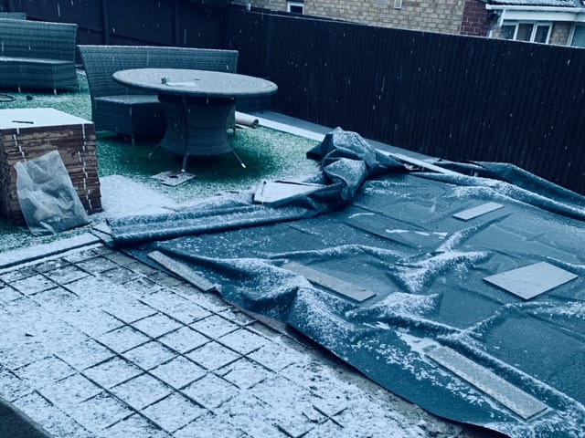 Snowy tiered garden before transform
