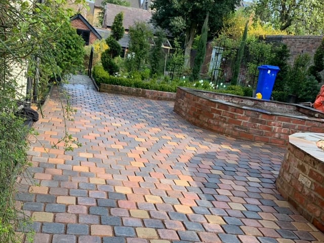 New bricked driveway with raised flower beds