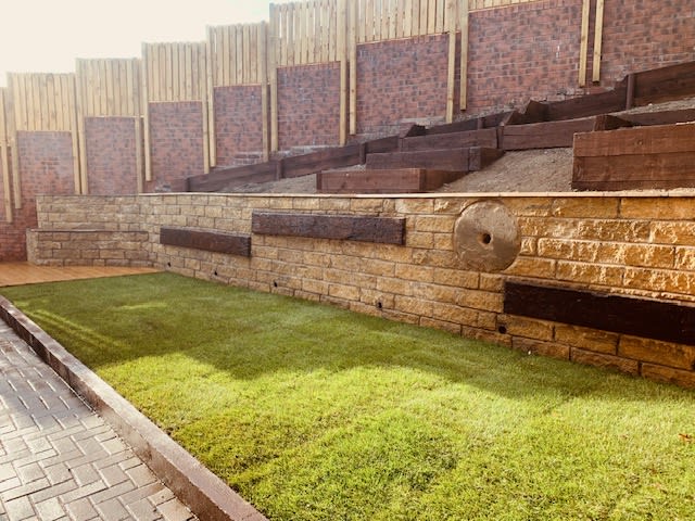 New tiered garden with flower beds and a new lawn