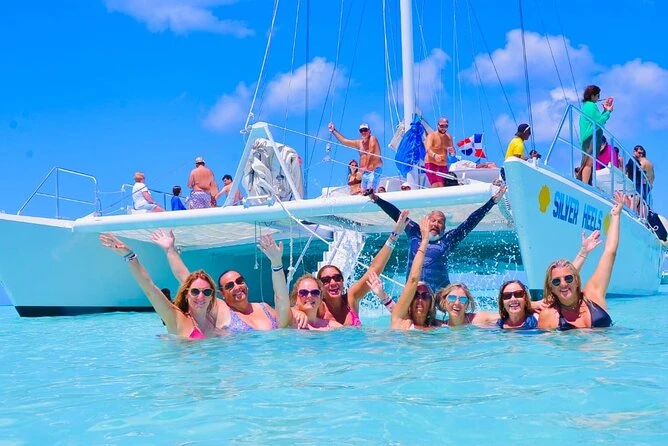 Group of friends toast on a boat during a Saona Island excursion
