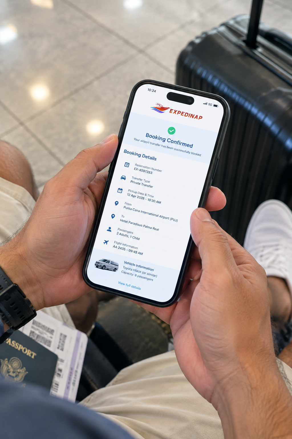 Traveler checking an airport transfer reservation on a smartphone in a Punta Cana hotel lobby