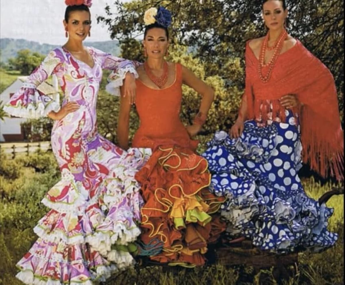 Spanish Girls In Traditional Dress Walking At The Seville Fair Stock ...