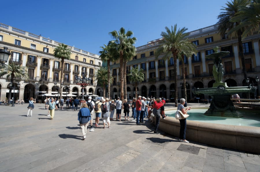 a bunch of tourists in main barcelona landmarks