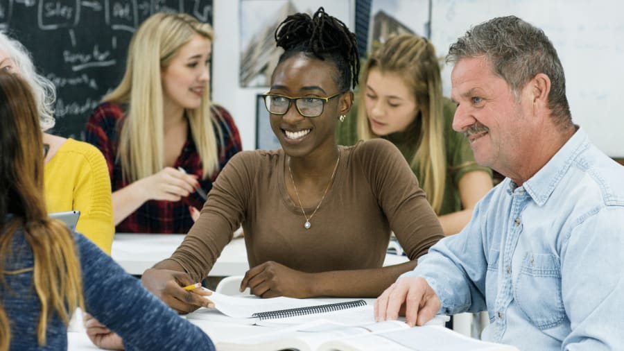 Attend a class to learn spanish
