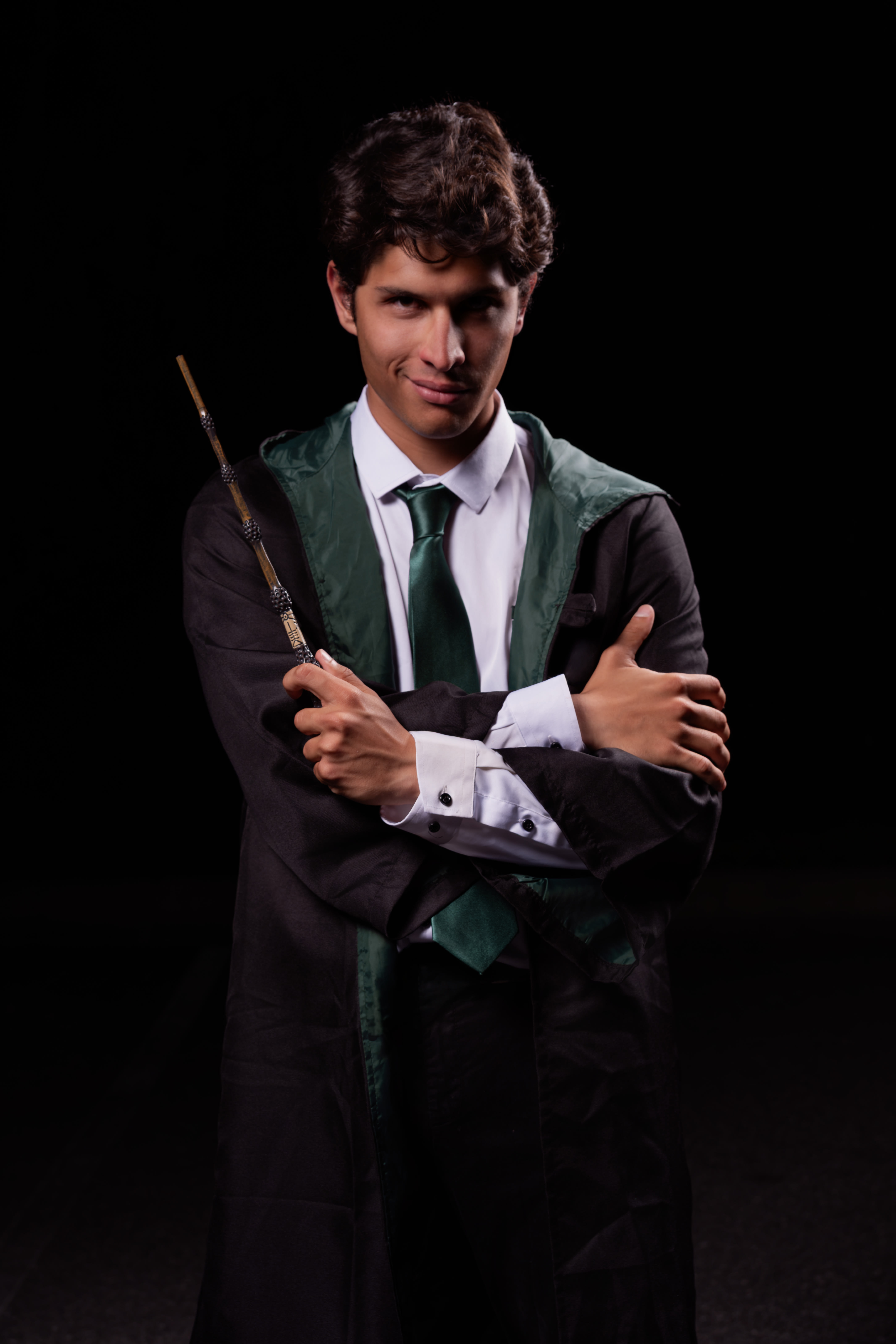 Guest in Slytherin robes with wand