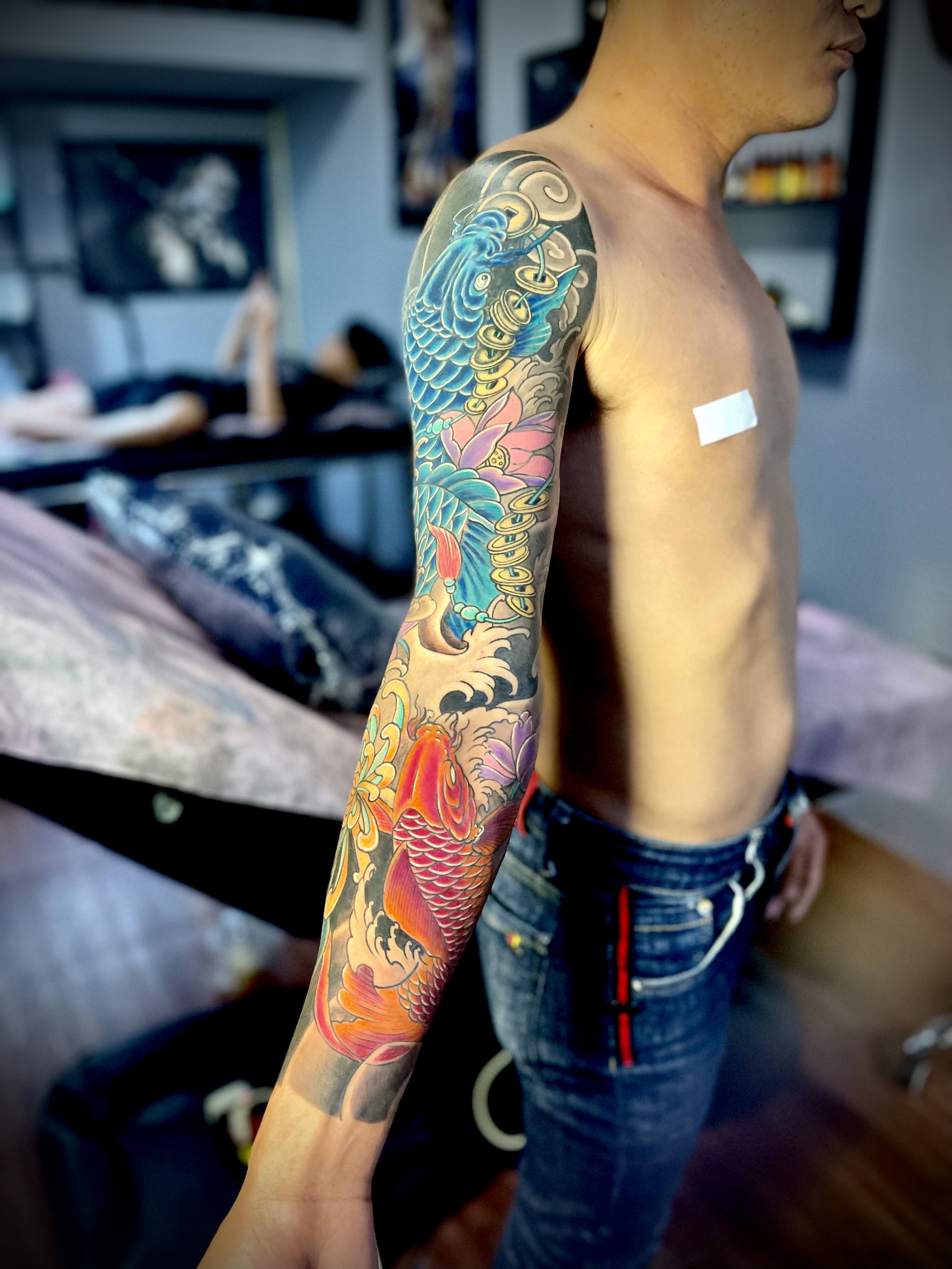 Full sleeve carp tattoo done directly by Tran Ky Tattoo - 2