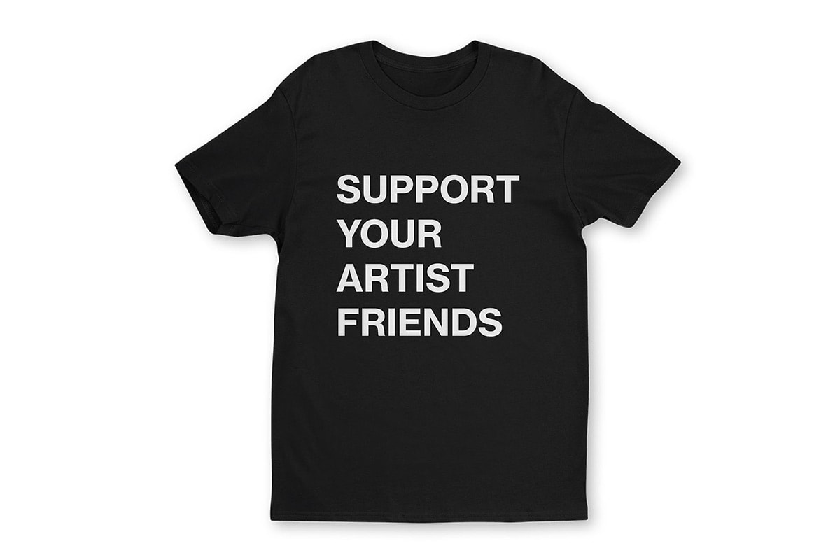 A black crew neck t-shirt with large bolded words that read 'SUPPORT YOUR ARTIST FRIENDS' in a stacked orientation.