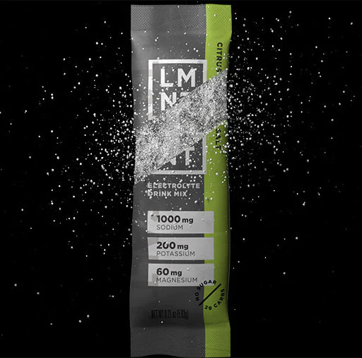 LMNT stick pack exploding with citrus flavor
