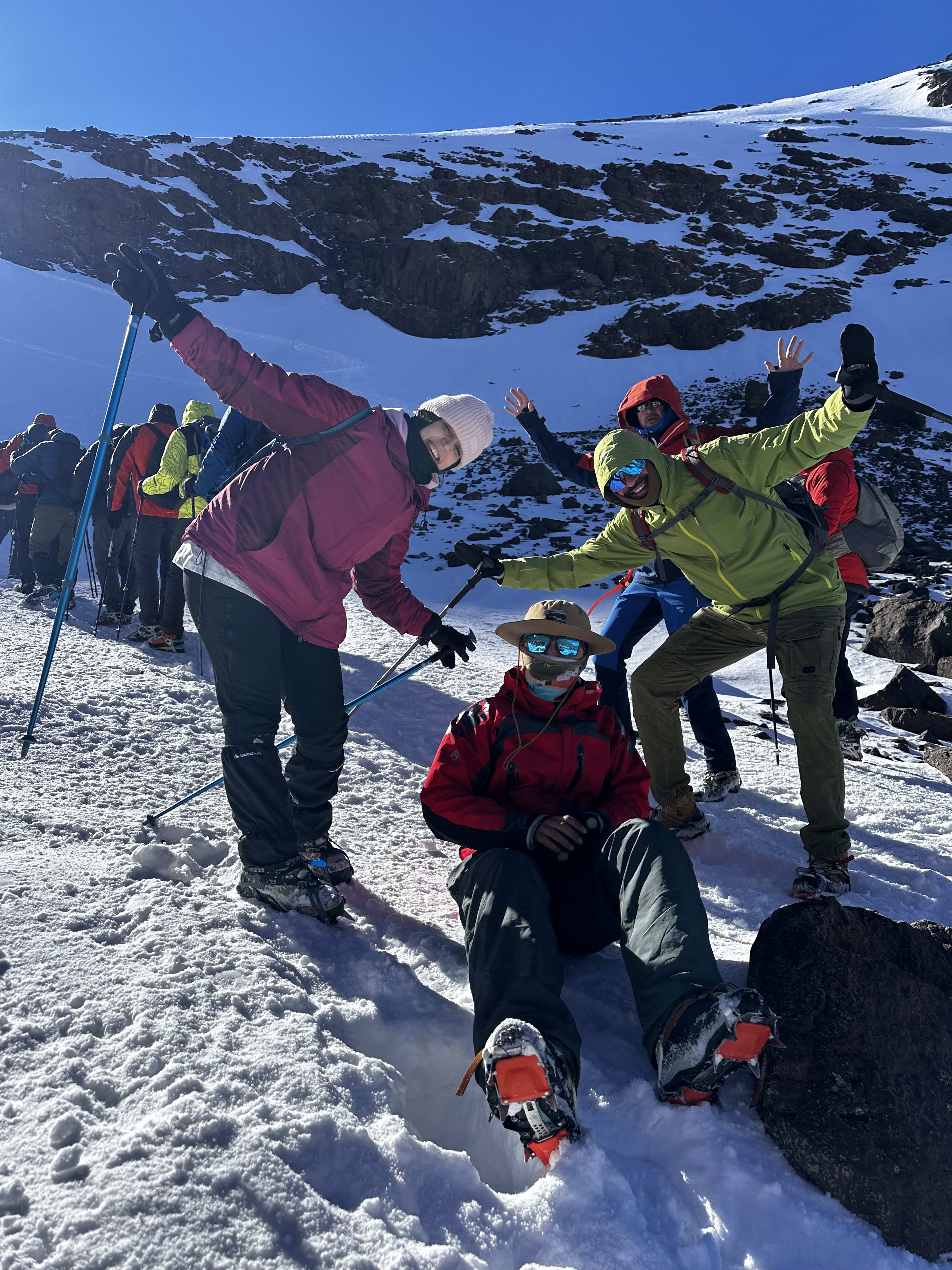 Local Berber guide leading a group through mountain paths in Atlas Mountains