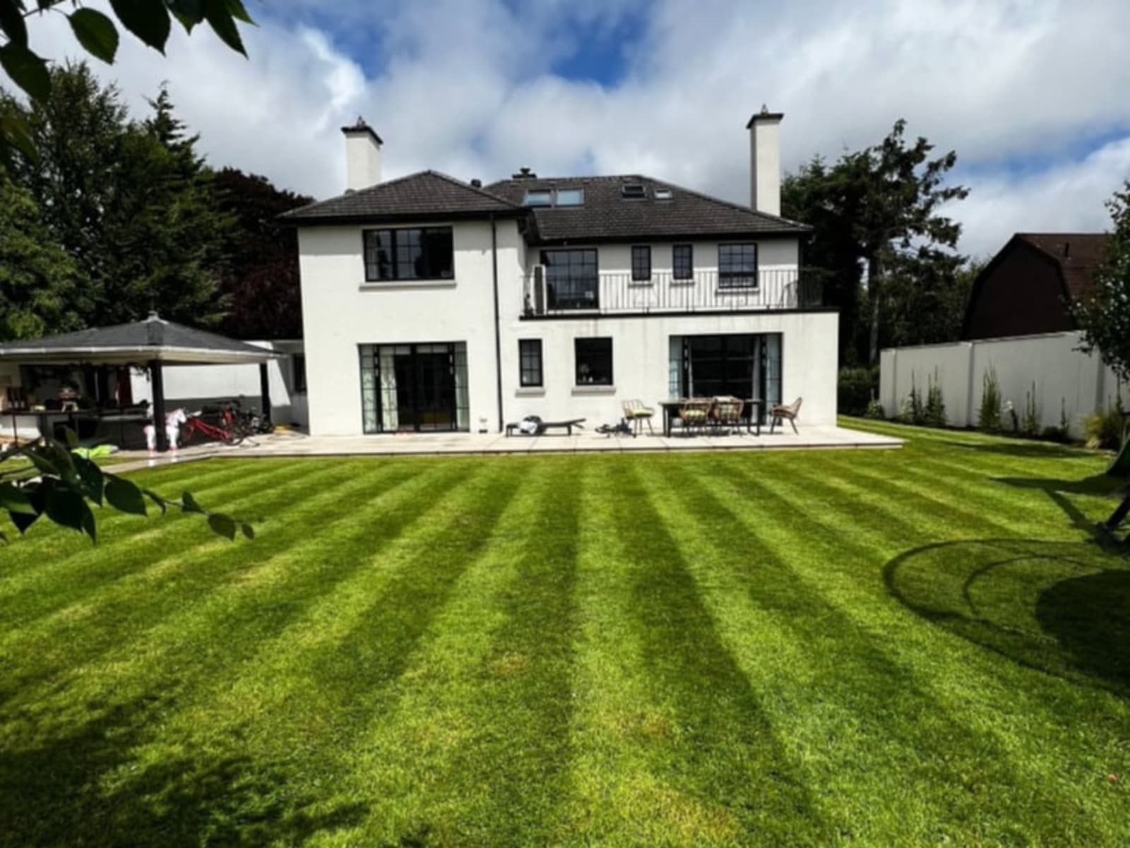 Striped manicured lawn with modern Dublin home