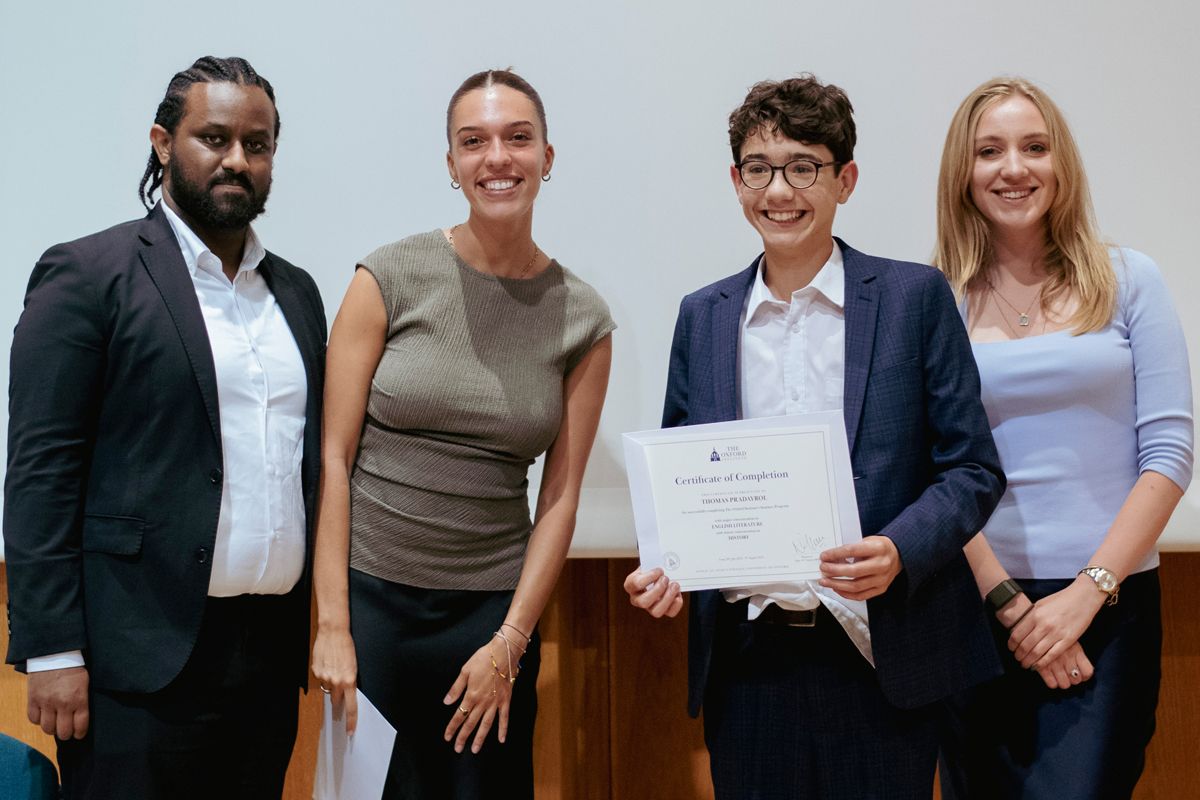 International friendships at Oxford Summer Program: Student from London proudly receives his certificate after connecting with peers from over 60 countries.