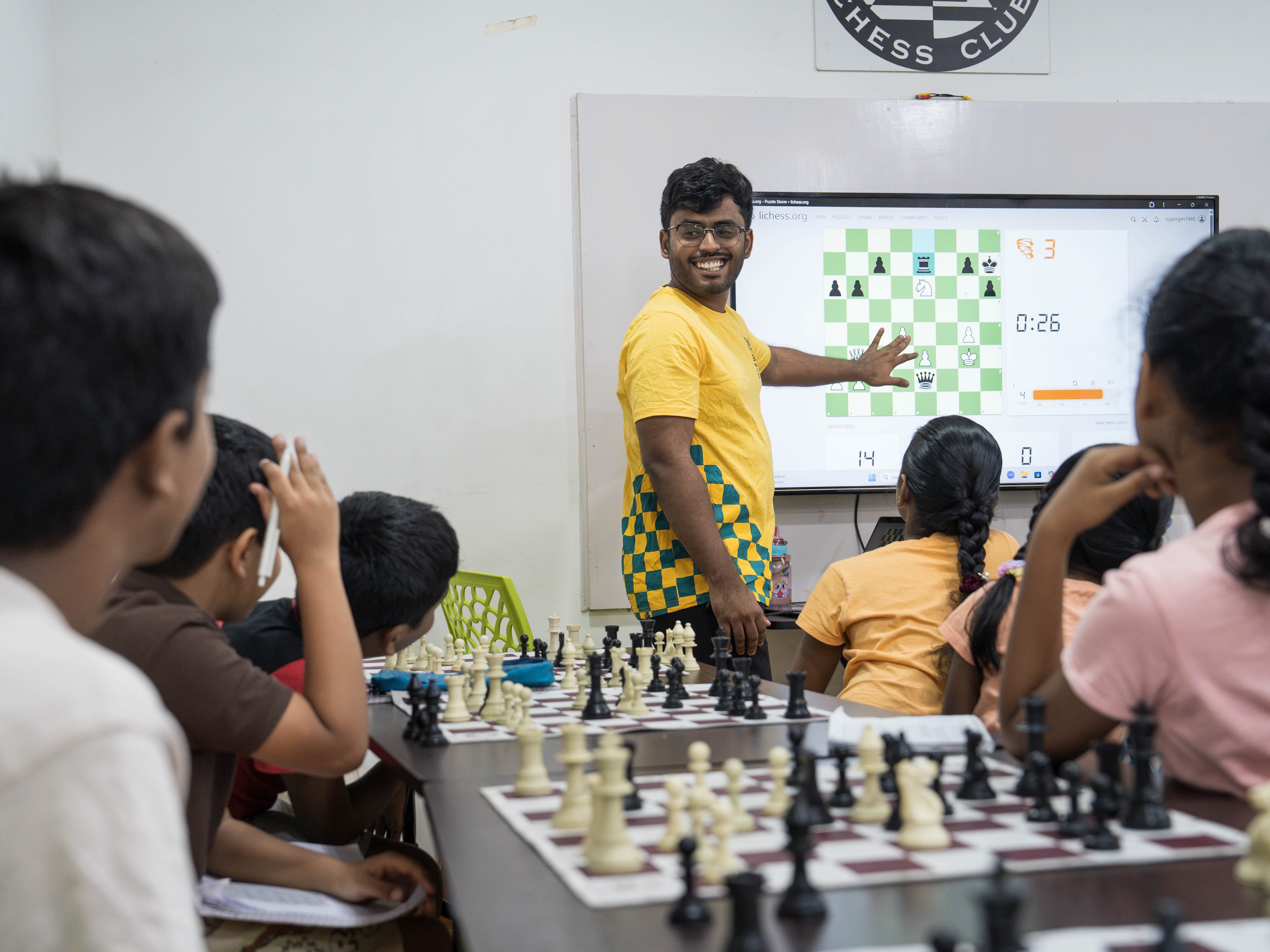 Chess Coach Teaching Student