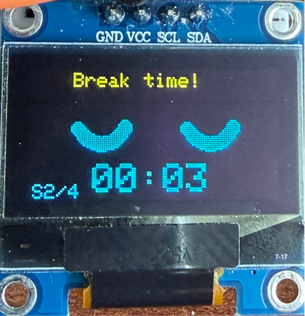 OLED showing smiling eyes and Break time