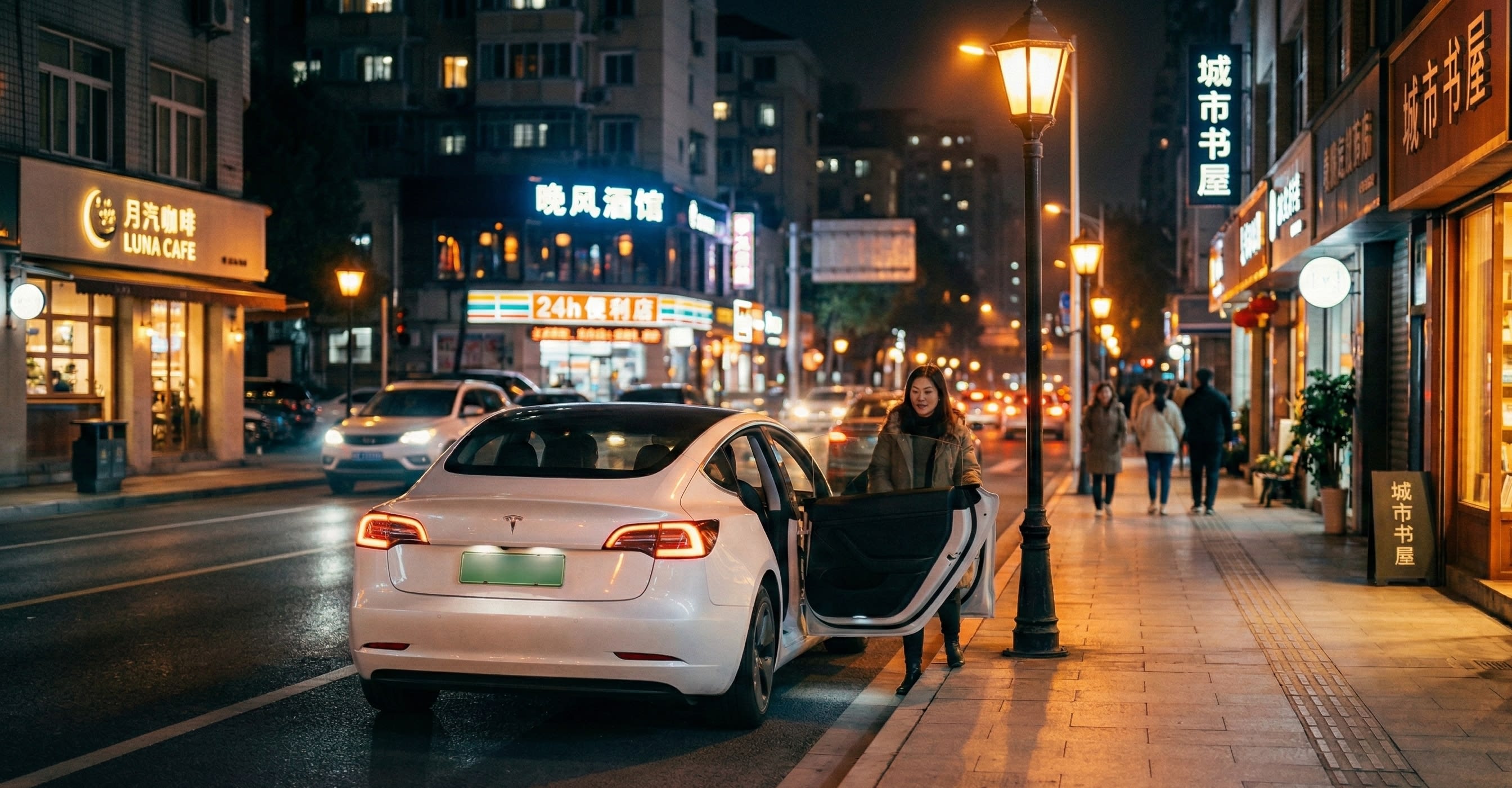 A white sedan pulling over to the curb at night to drop off a passenger