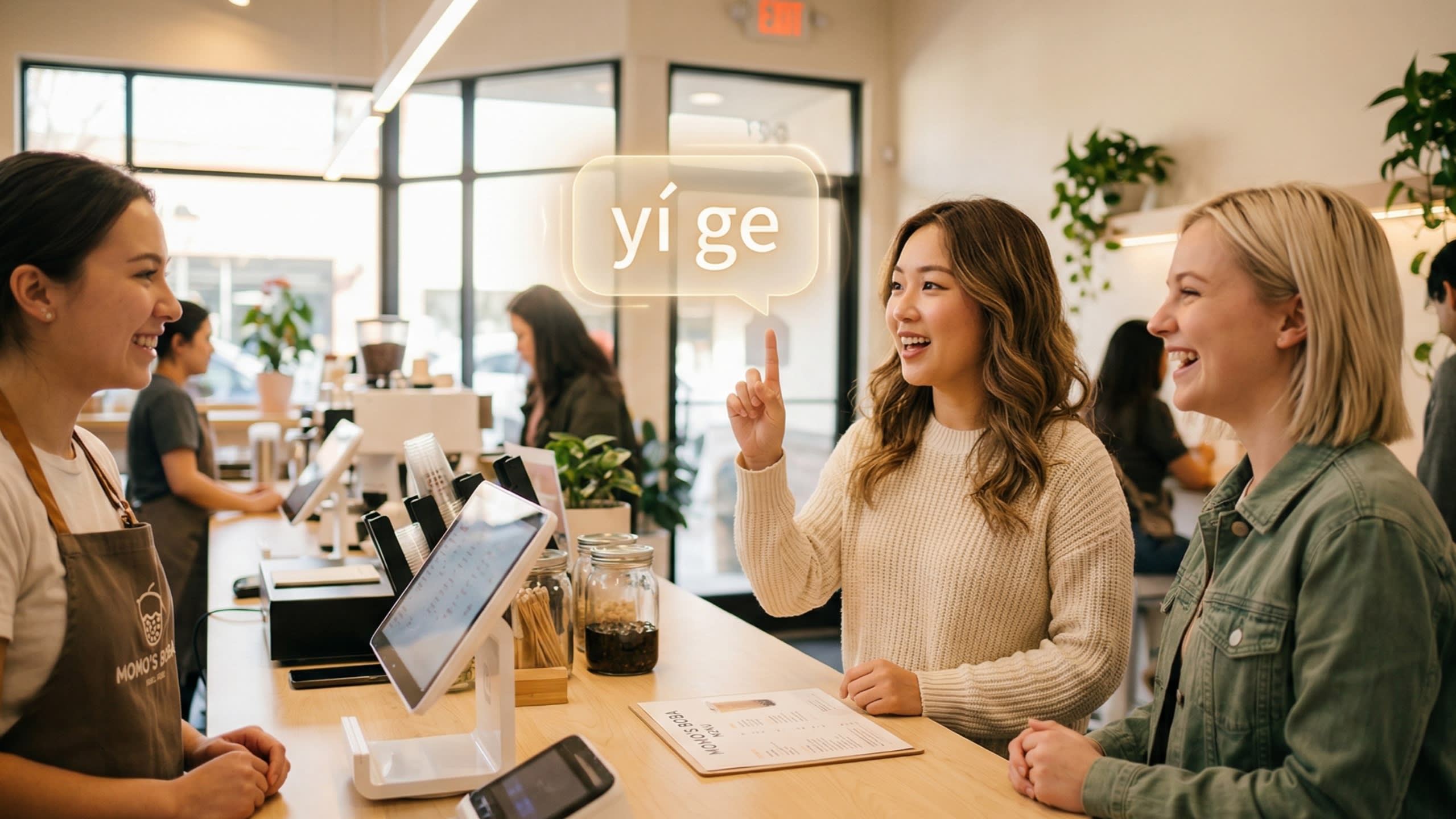A candid, warm photography shot of two friends at a modern bubble tea shop. One is holding up one finger to the barista while happily ordering. Floating above her finger is a digital text bubble reading '一个 (yí ge)', capturing the everyday usage of the 2nd tone shift.