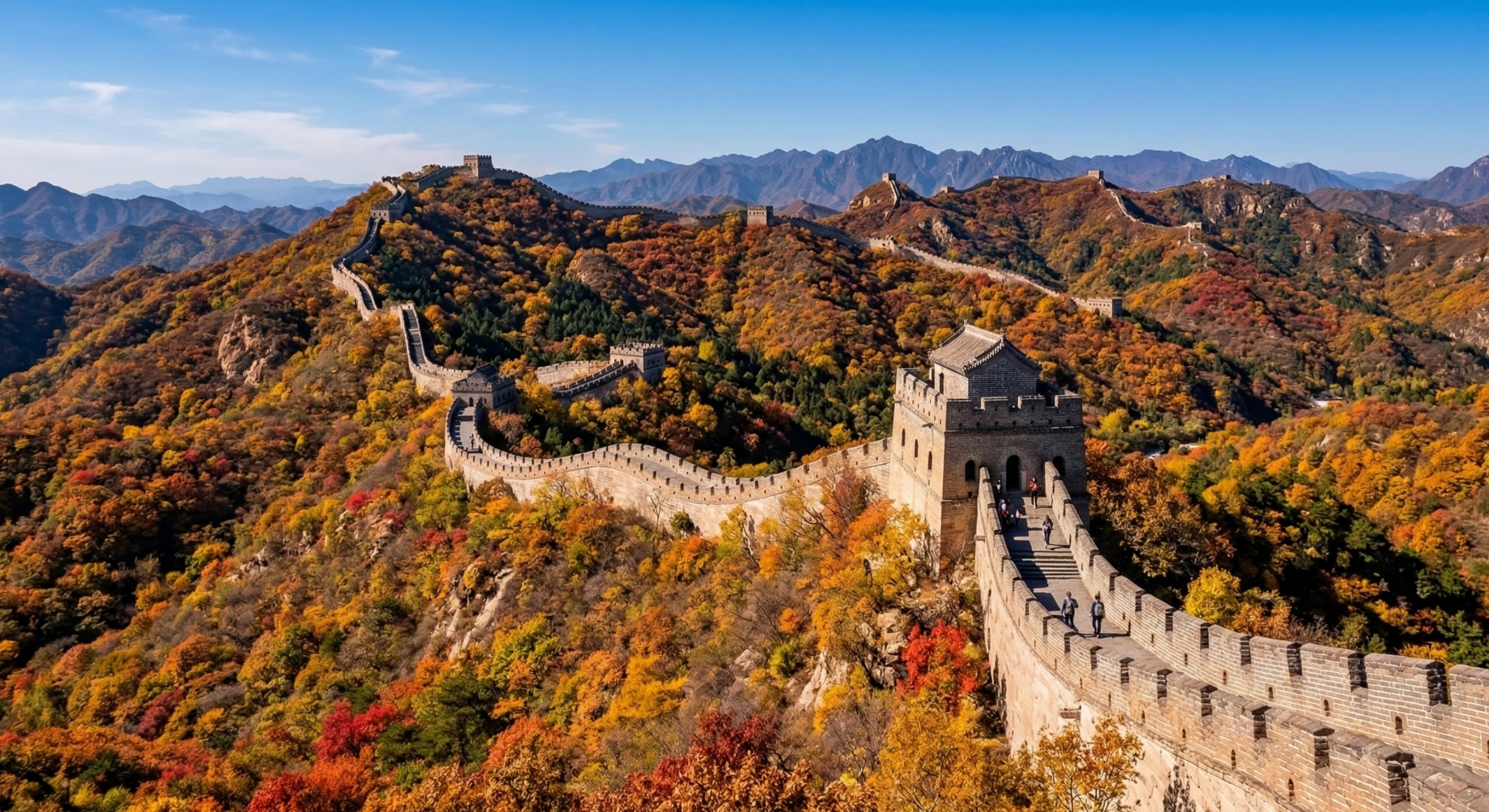 A majestic wide shot of the Great Wall of China snaking over mountains covered in peak autumn foliage