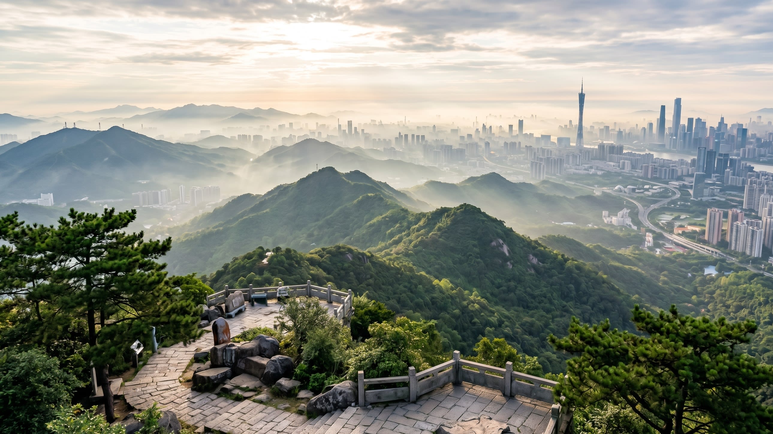 Image 2 - The mist-covered peaks of Baiyun Mountain overlooking the Canton Tower