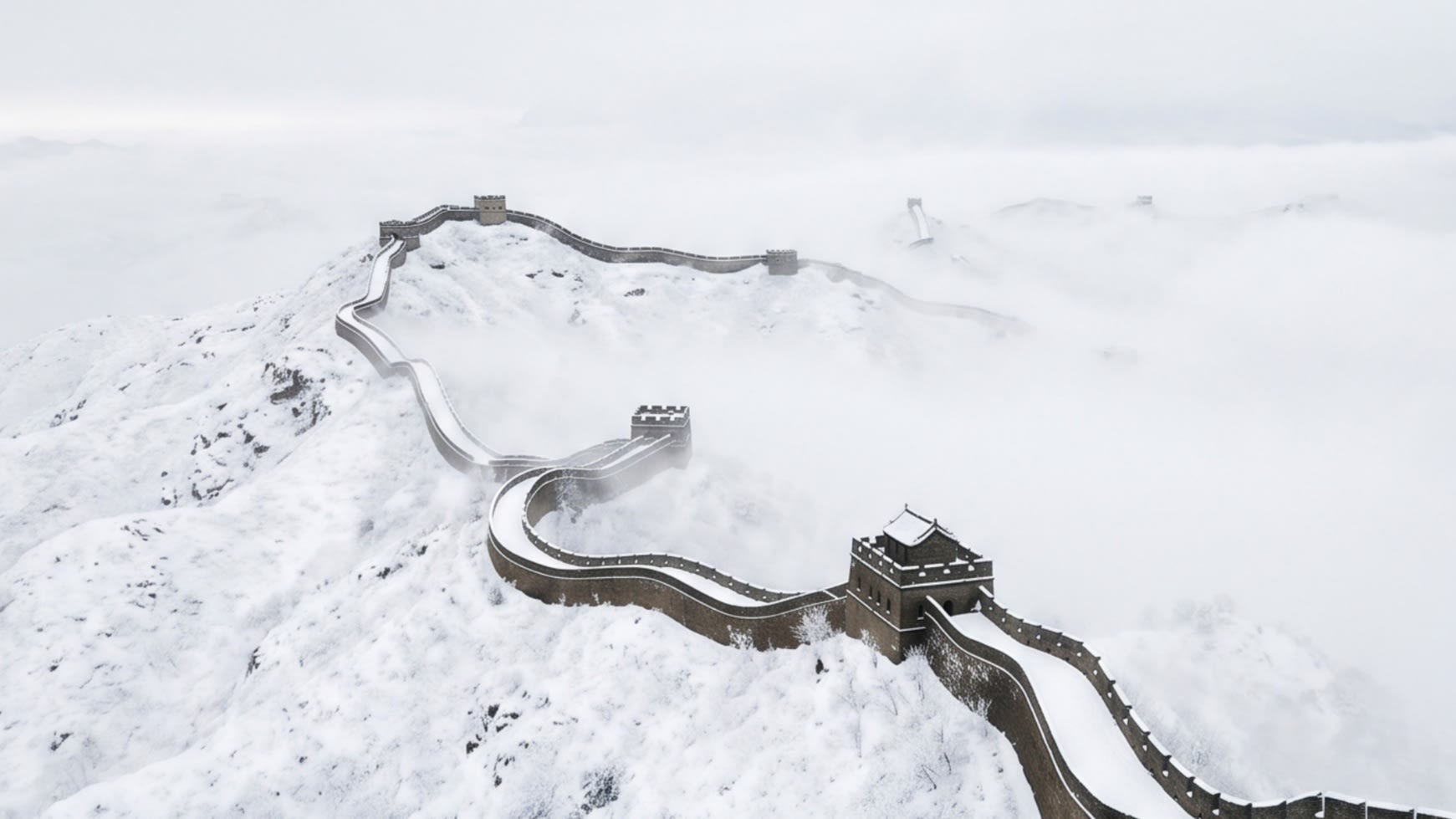 The graphic, snaking line of the Great Wall cutting through a snow-covered ridge