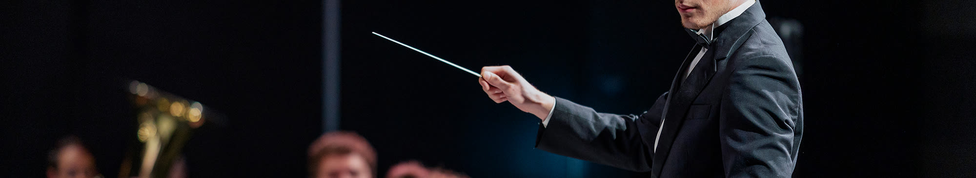 conductor holding a baton
