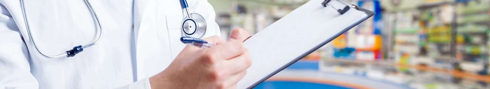 doctor writing on a clipboard