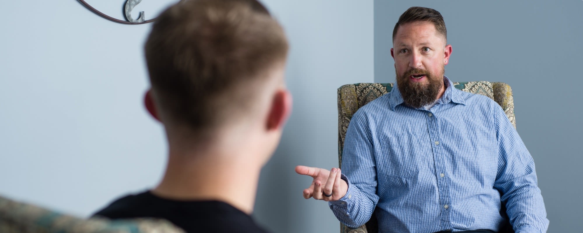 man speaking with student