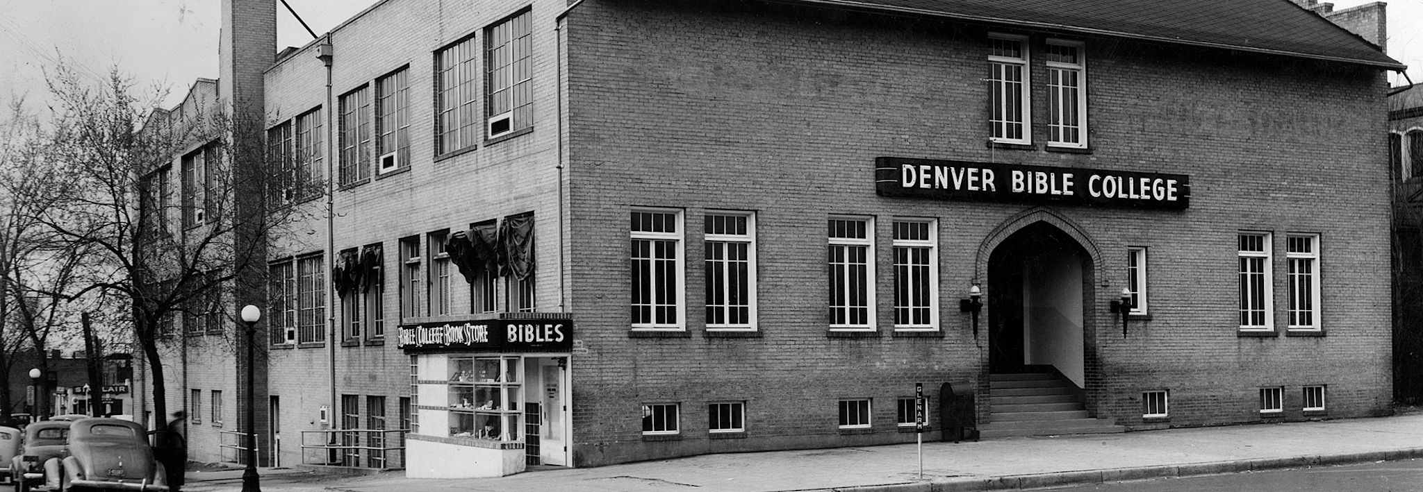 Black and white picture of Denver Bible College from a street view. 