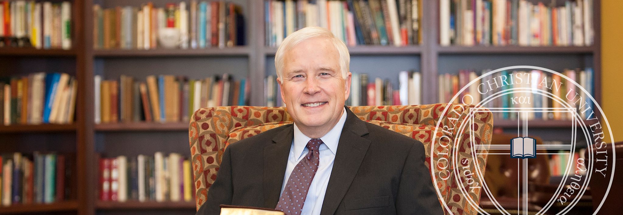 CCU's president, Dr. Donald W. Sweeting, is sitting in his office at the CCU campus.