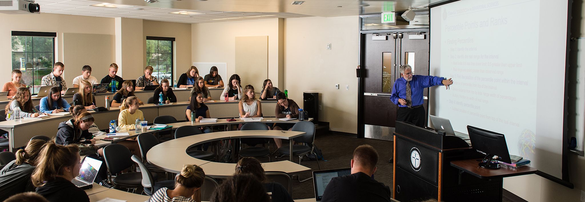 Undergraduate students sitting in class at CCU's Lakewood campus.