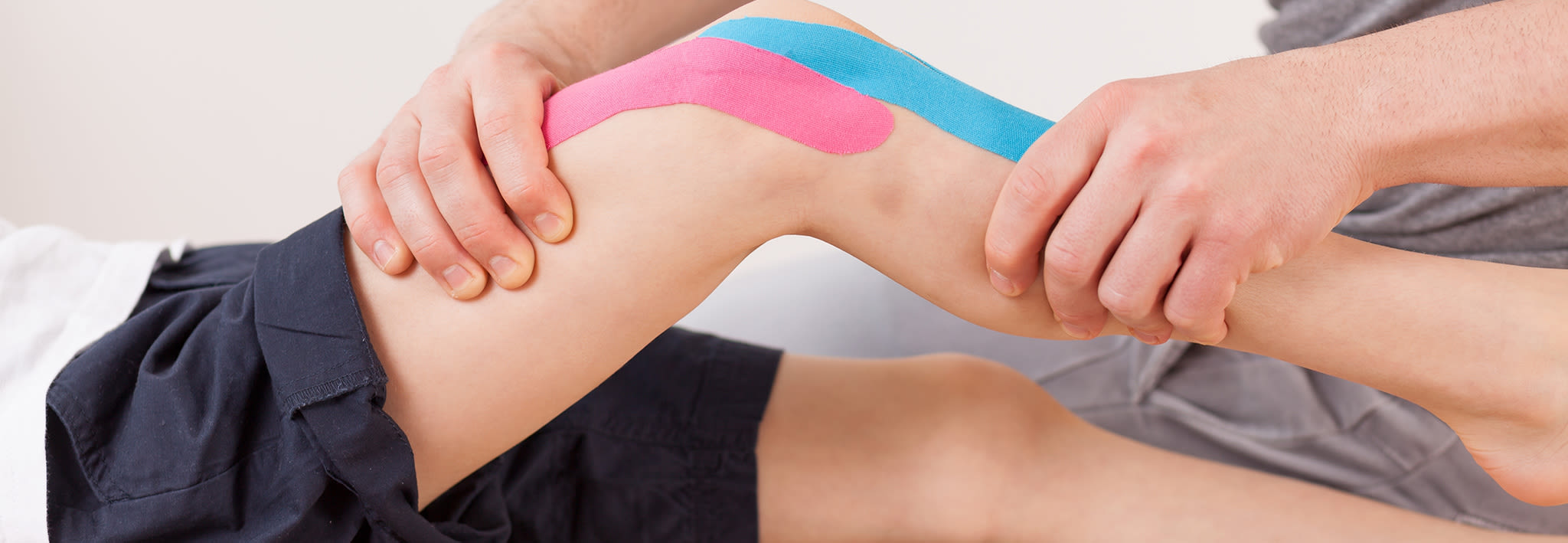 Young boy with injury receiving physical therapy.