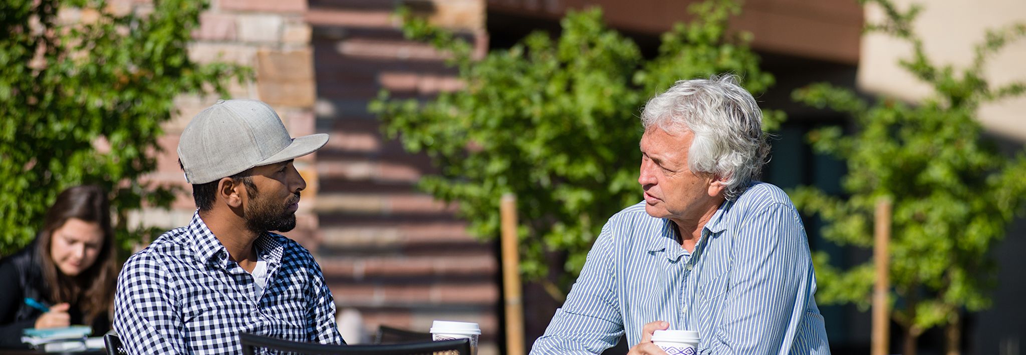 Pastor Dave and Nirup CCU's Pastor Dave is speaking to Nirup on the CCU campus.