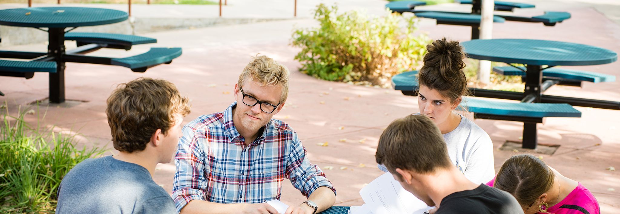 A group of students studying in Sanders Court at CCU.