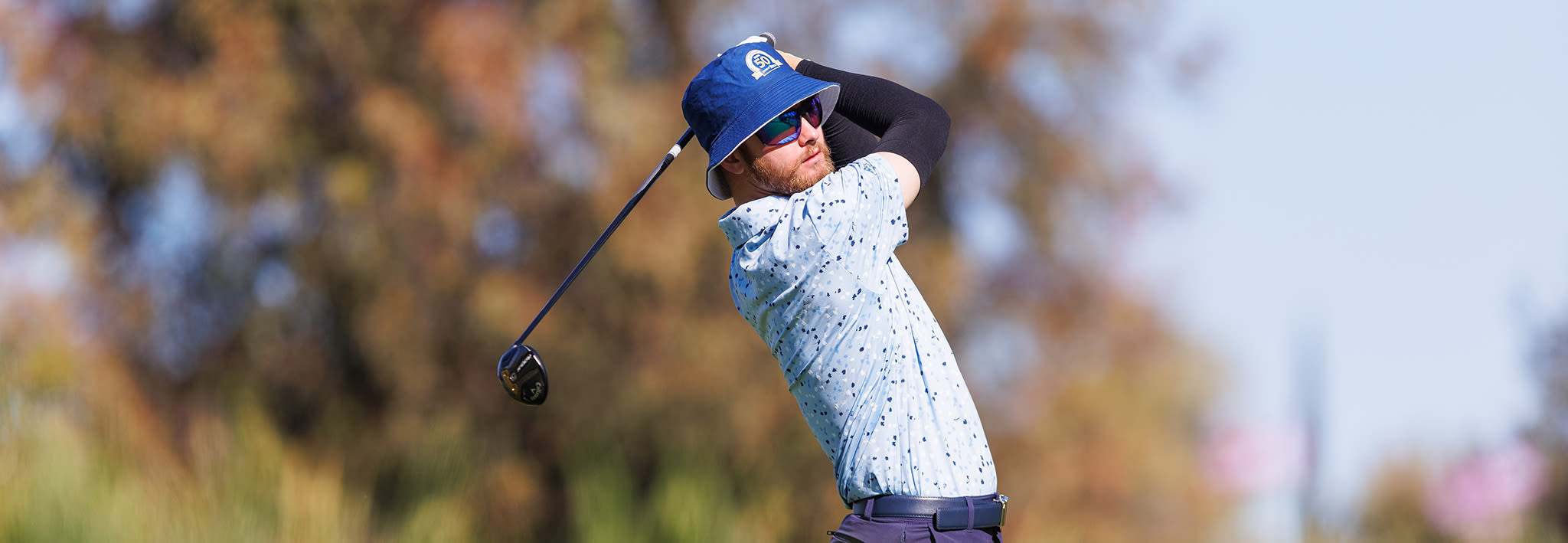 male ccu student on golf green
