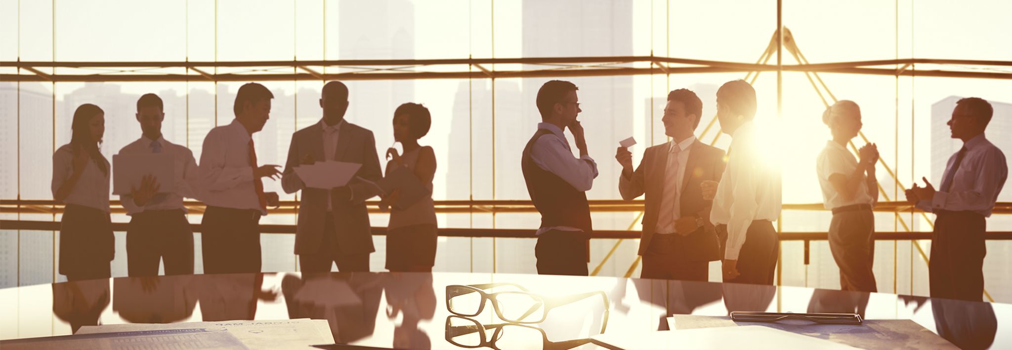 A professional networking event Employees are learning about CCU's tuition discount program at a networking event.