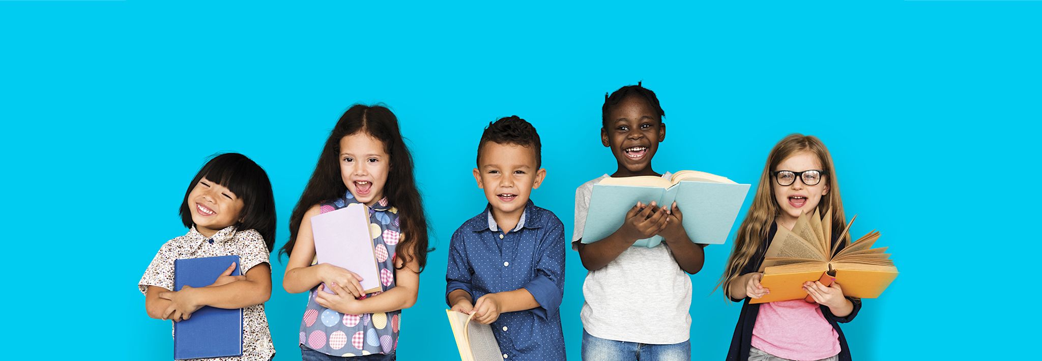 A group of elementary education children are excited about their new school books.