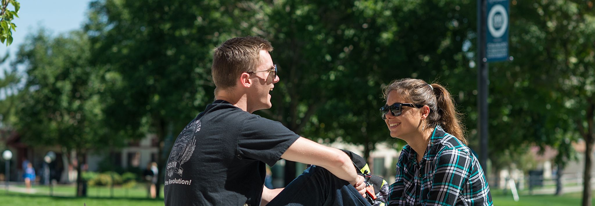 Students on CCU's Lakewood campus chatting. 