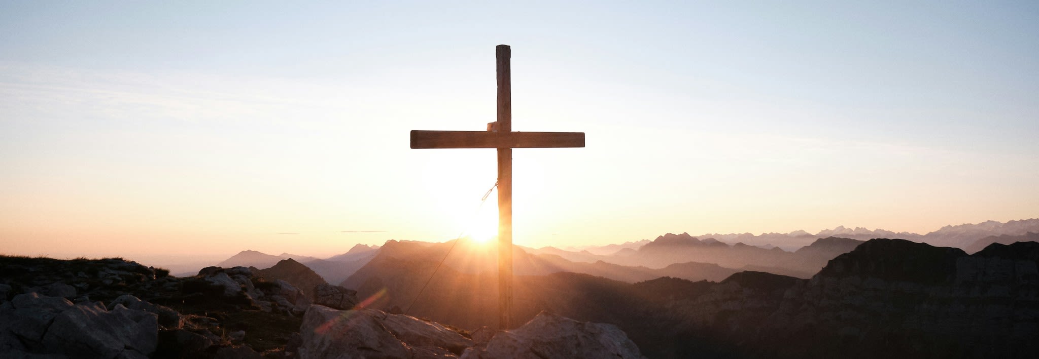 wooden cross with sunlight