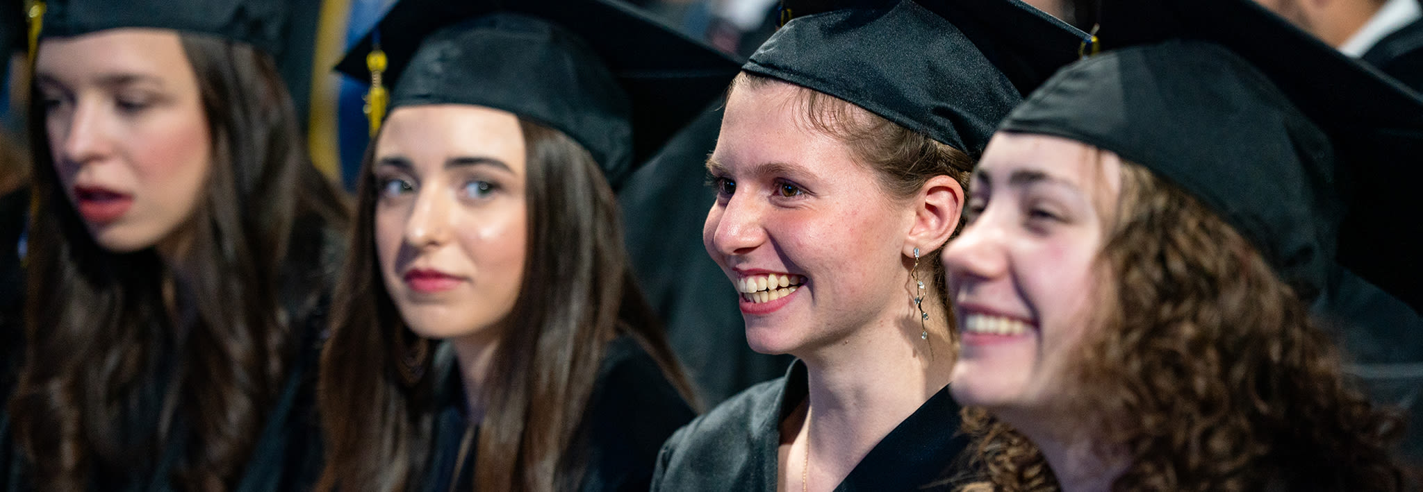 female ccu students smiling while attending graduation