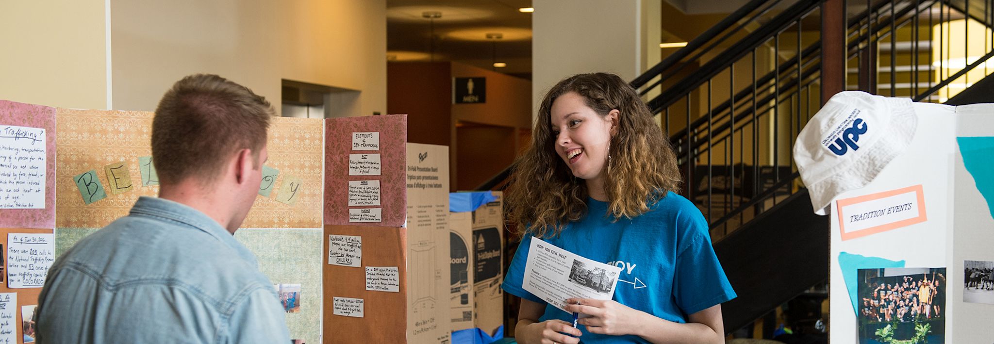 College student at CCU getting information about a club. 