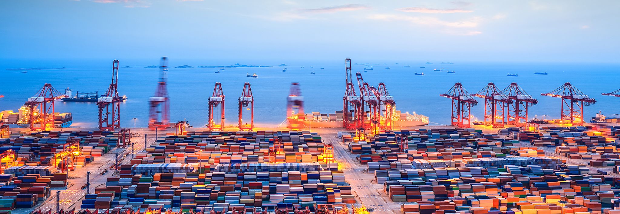 International shipping yard at dusk. 