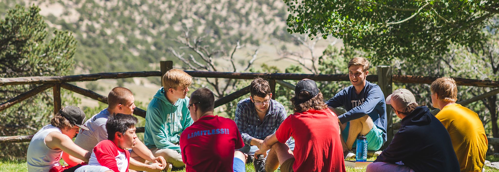 CCU students talking on a camping trip.